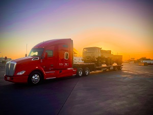 Red Flat Bed Truck with sunset